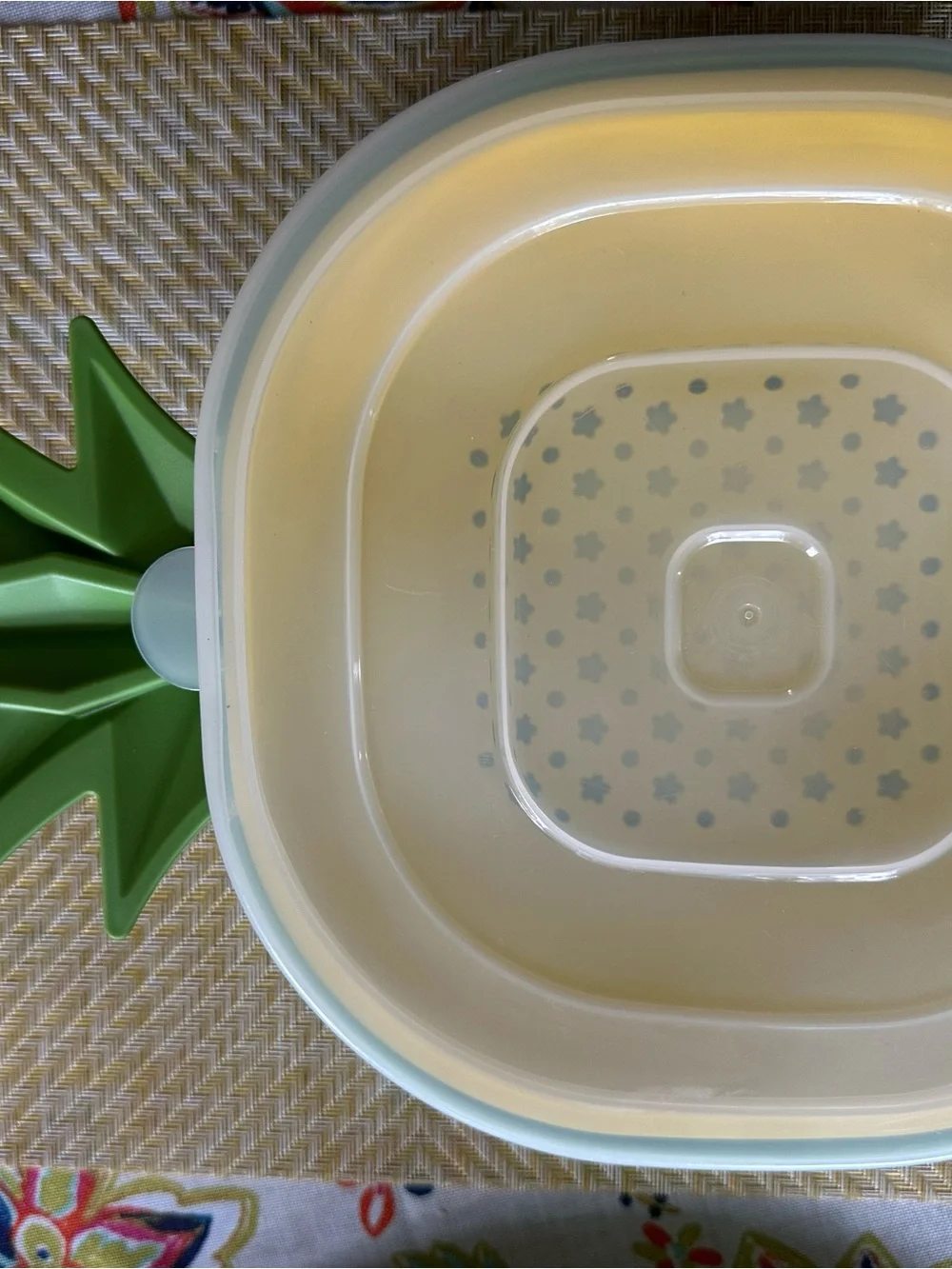 Croton Pineapple-Shaped Cutting Board in Yellow with Green Trim and Colander.